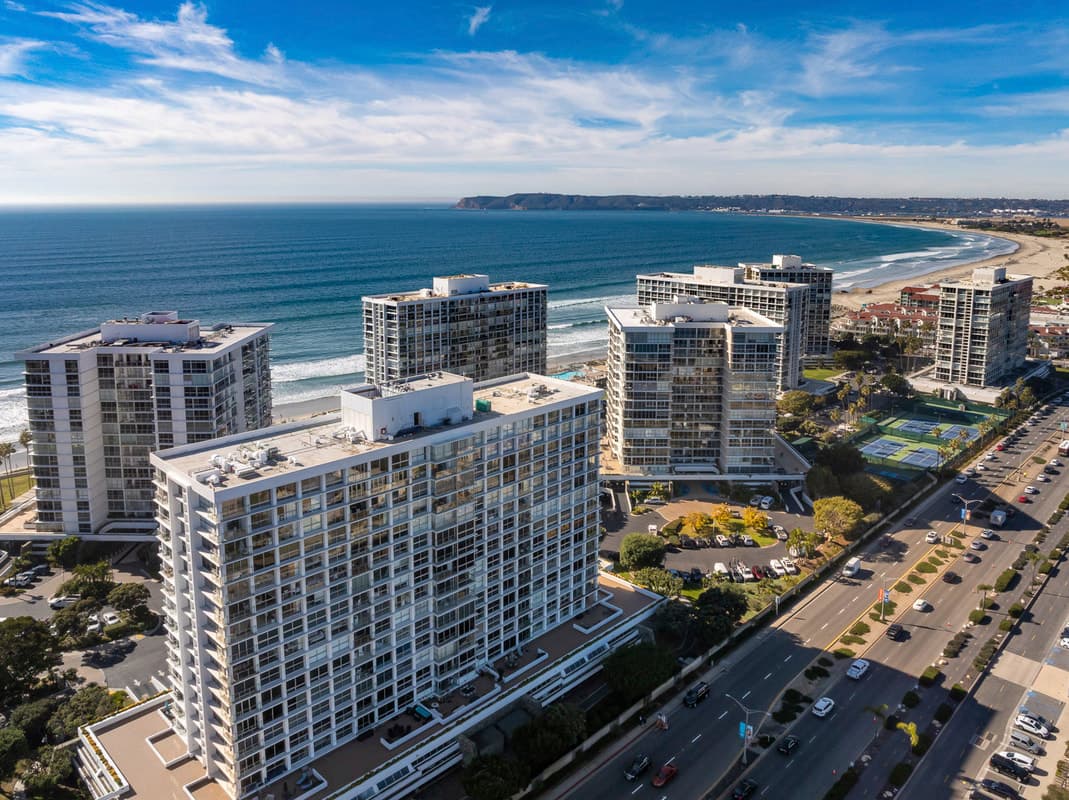 Aerial view of the Coronado Shores oceanfront towers along the Silver Strand beach